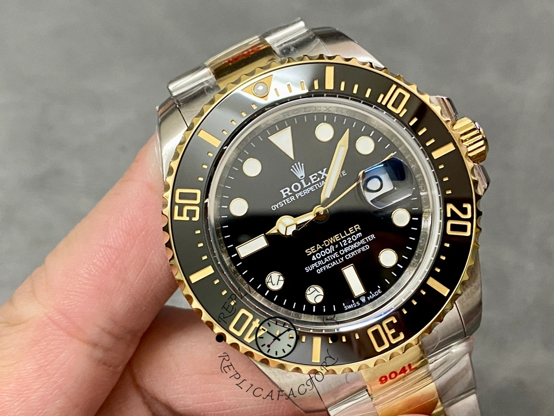 Rolex Sea-Dweller 126603 0001, dial close-up in hand showing luminous markers.