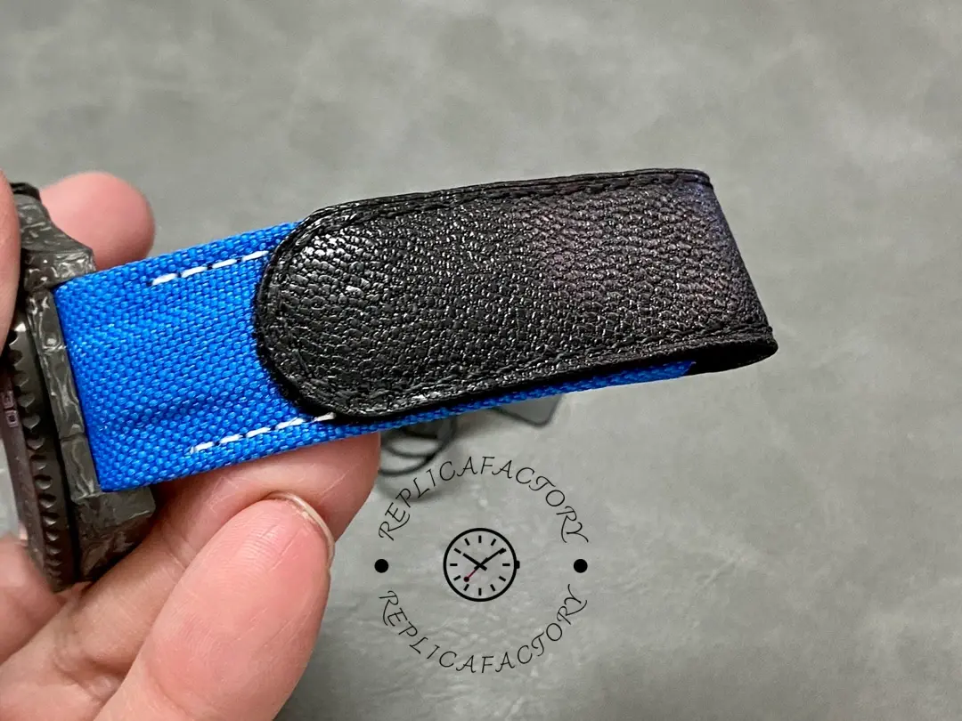 Rolex Sea-Dweller DiW Carbon Fiber, blue strap underside and stitching detail.