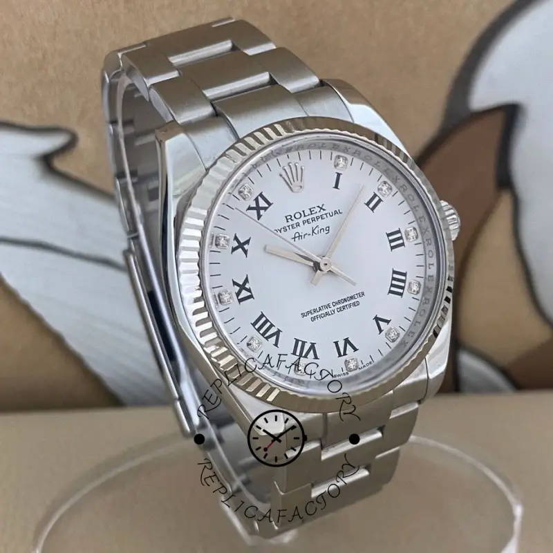 Rolex Oyster Perpetual Air-King 114234, side angle showing crown and fluted bezel, white diamond dial.