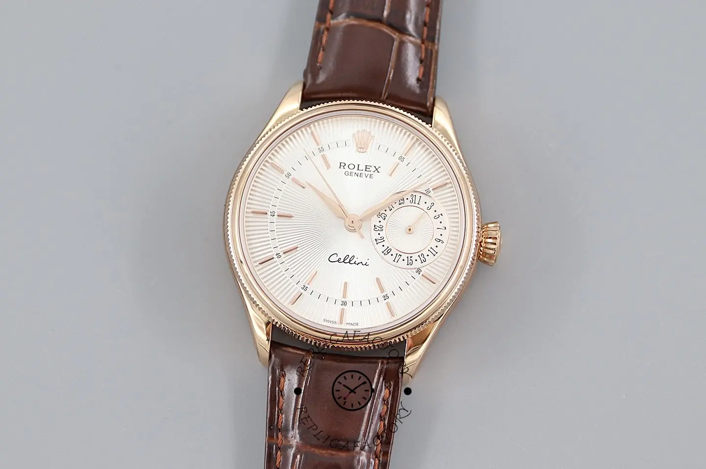 Rolex Cellini Date 50515 front view on light background, silver dial and brown crocodile strap.