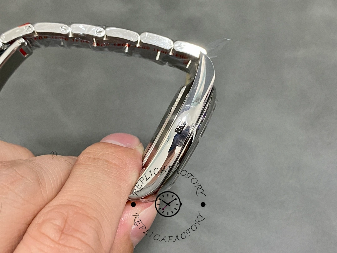 Rolex Oyster Perpetual Air-King 114200, side angle in hand showing case profile and bezel.