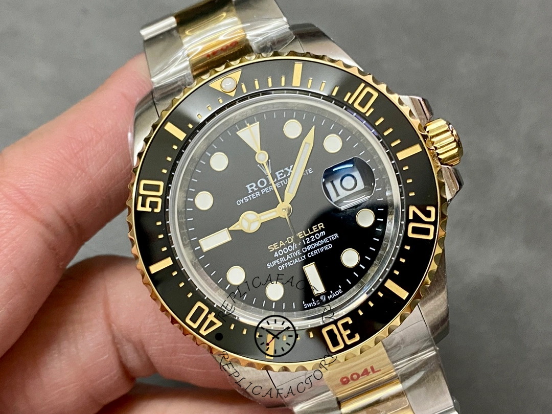 Rolex Sea-Dweller 126603 0001, hand-held close-up showing bezel markers and crown.