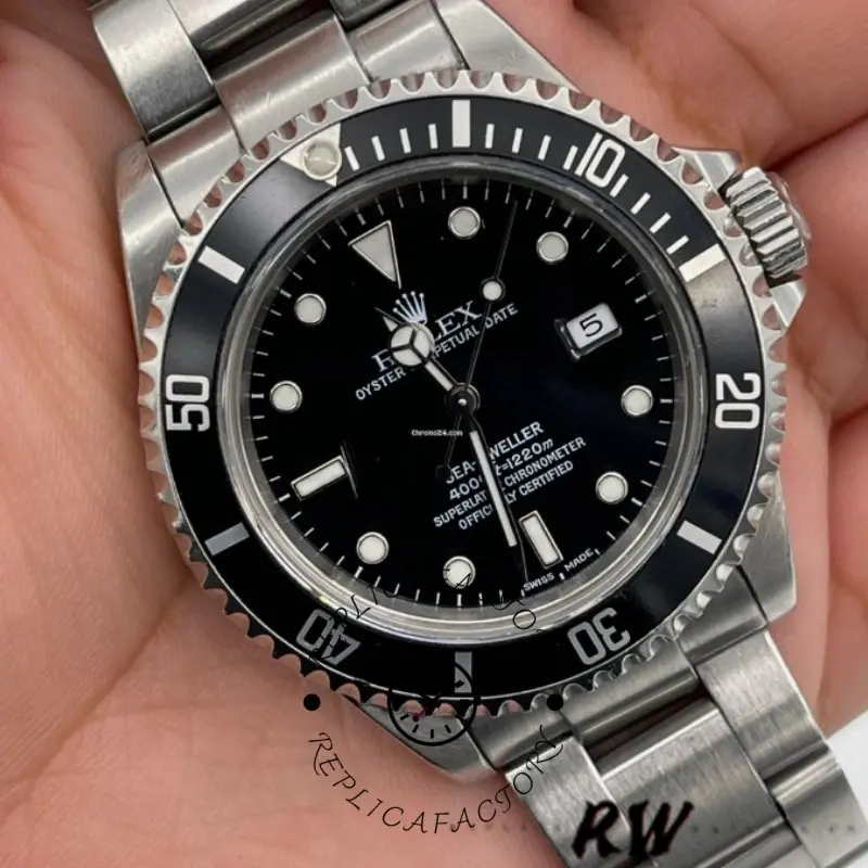 Rolex Sea-Dweller 4000 16600, close-up in hand, bezel and dial details.