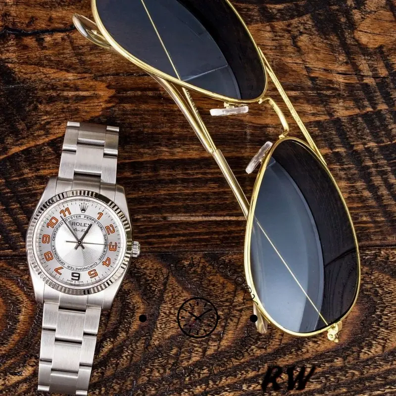 Rolex Oyster Perpetual Air-King 114234, lifestyle wrist shot with silver orange Arabic dial.