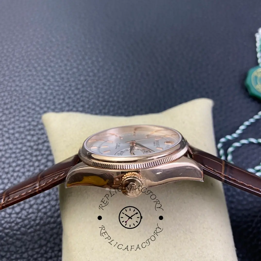 Rolex Cellini Date 50515 side view on cushion, showing rose gold case profile and crown.