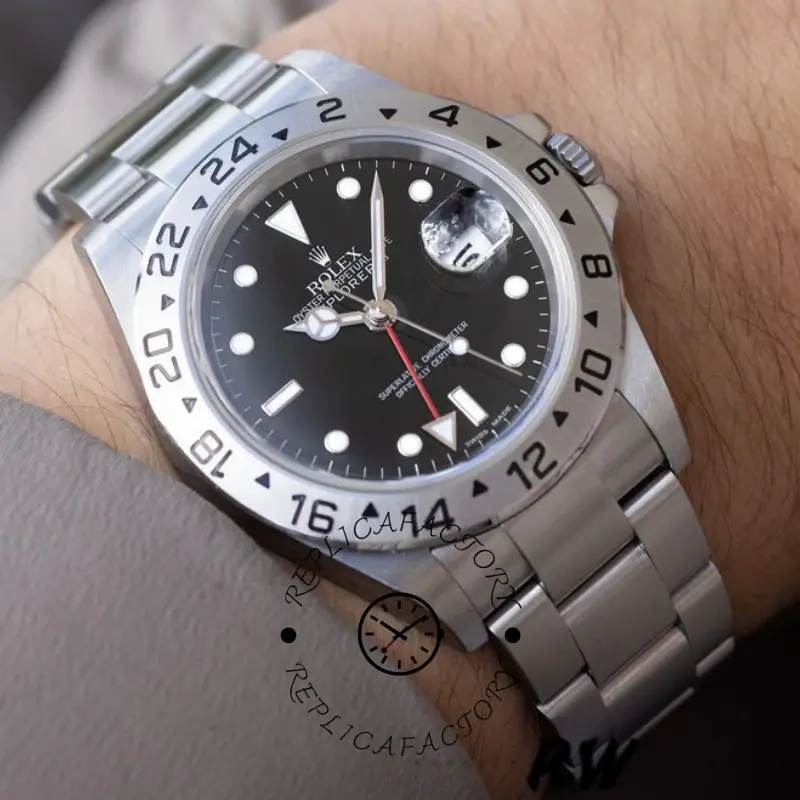 Rolex Explorer II 16570 on wrist, 40mm black dial, stainless steel bracelet, front view.