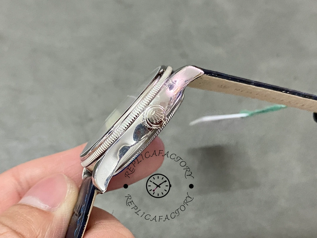 Rolex Cellini Date 50519 case side close-up, polished profile, crown and bezel edge, blue strap.