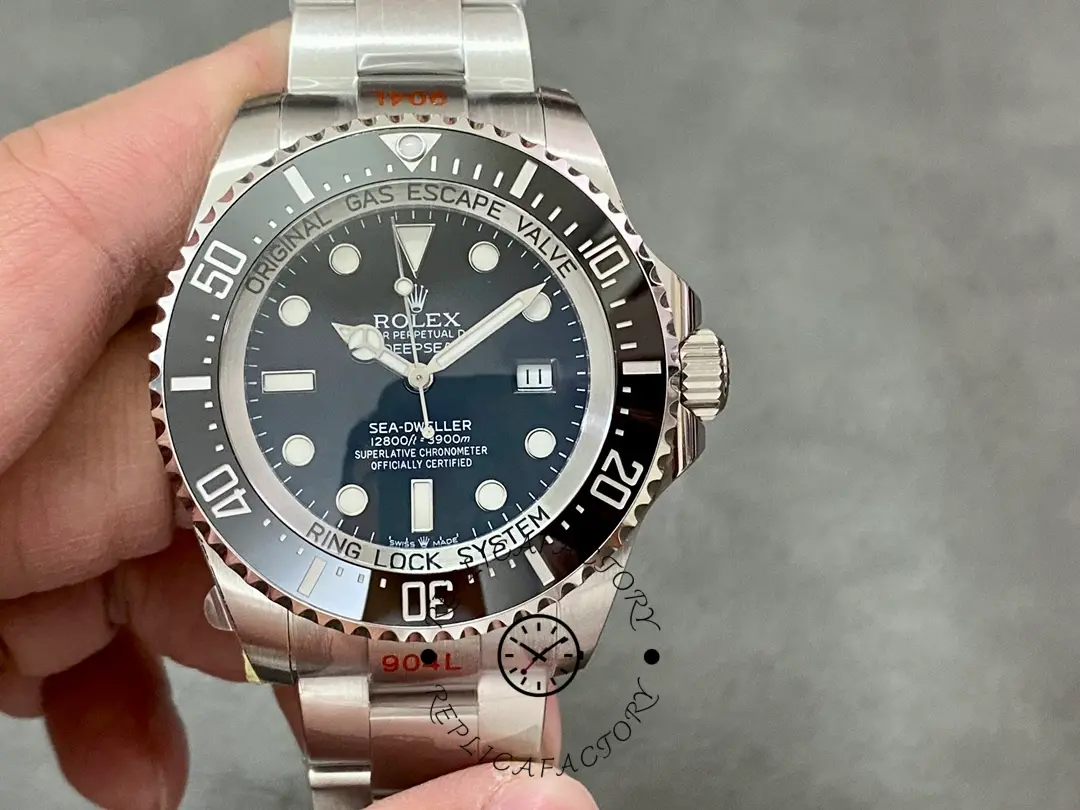 Rolex Deepsea 126660 held in hand, black dial and bezel, Oyster bracelet, front view.