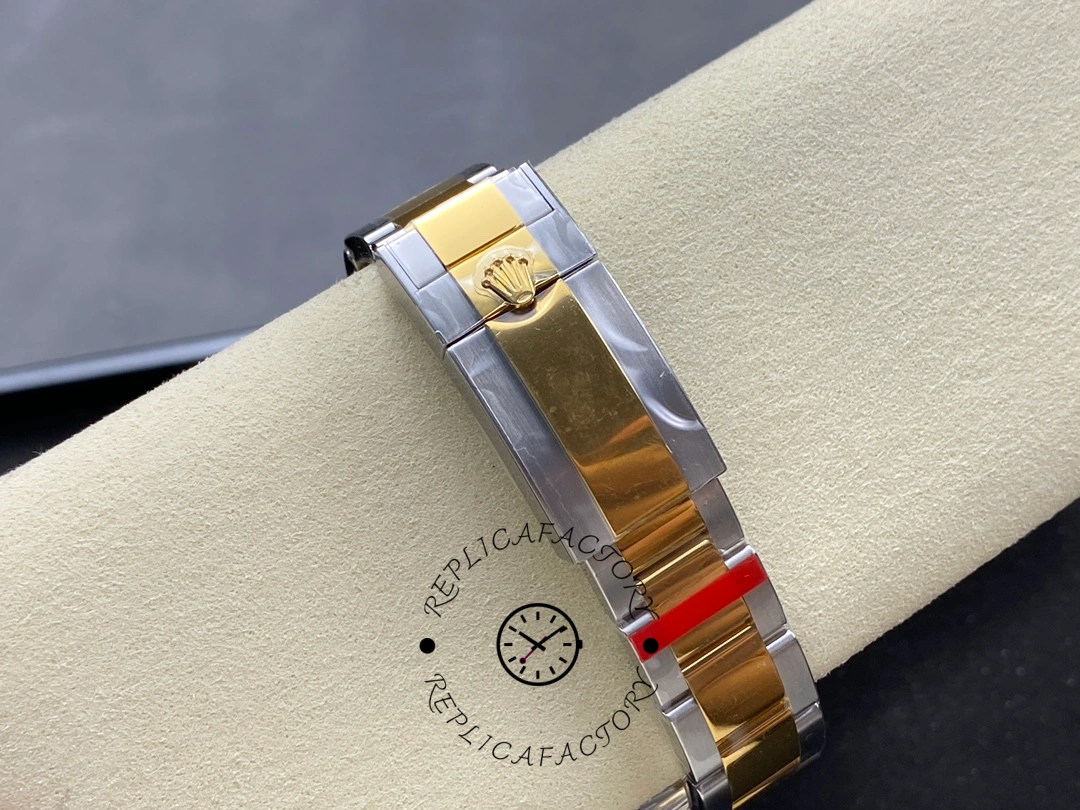 Clasp close-up of Rolex Explorer M124273-0001, two-tone Oyster bracelet details.