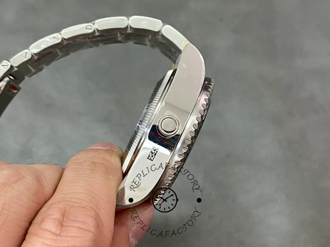 Rolex Deepsea 126660 side profile, thick case and bracelet links, held in hand.