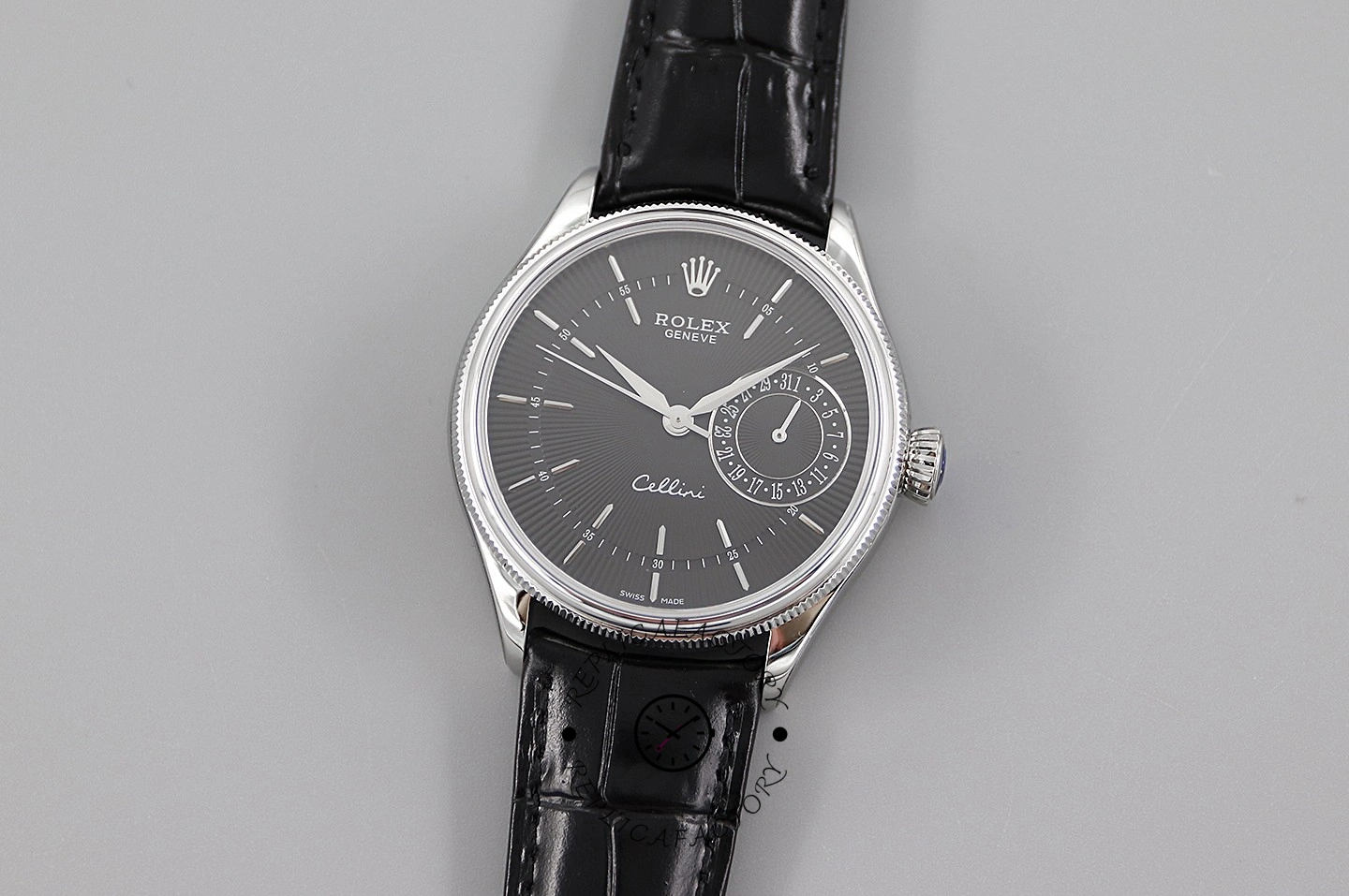 Rolex Cellini Date 50519, front view on grey background with black dial and strap.