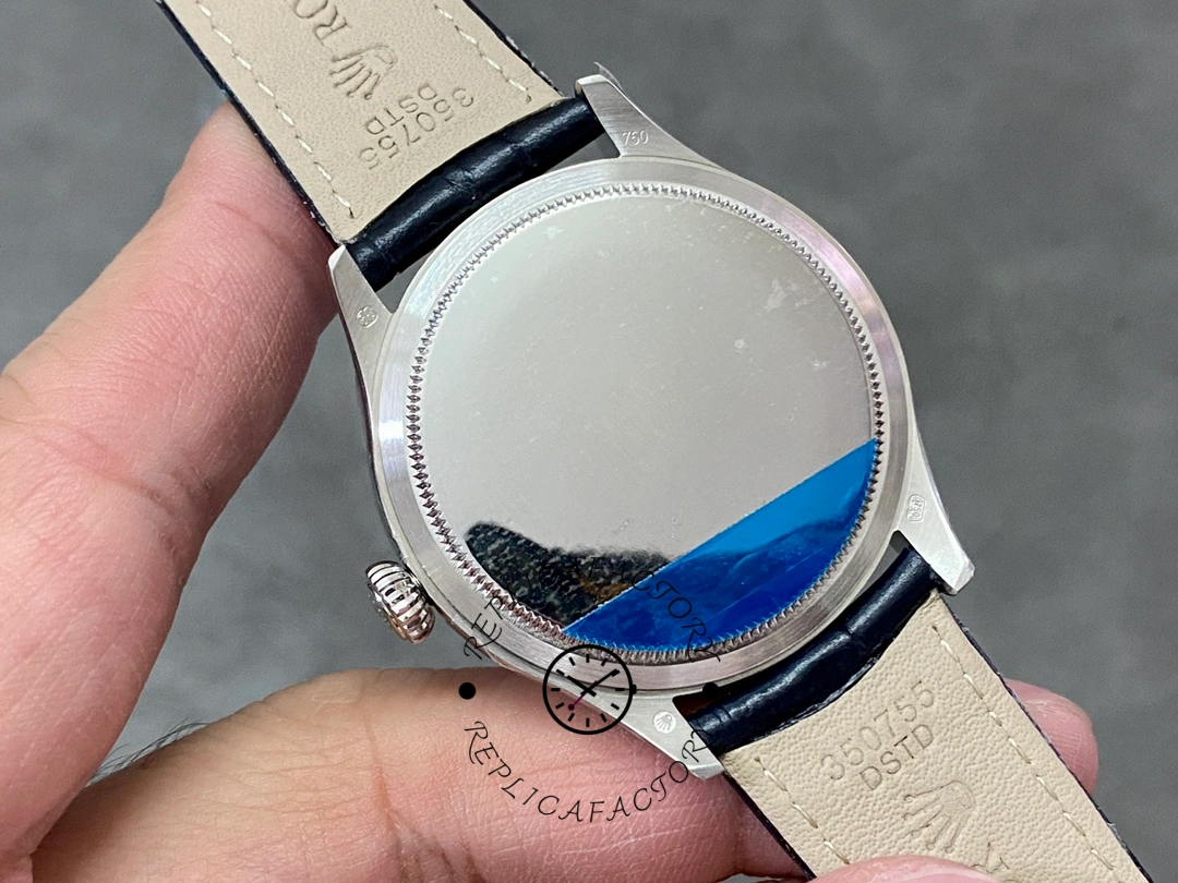 Rolex Cellini Date 50519 case back view, smooth back with protective film, blue leather strap.