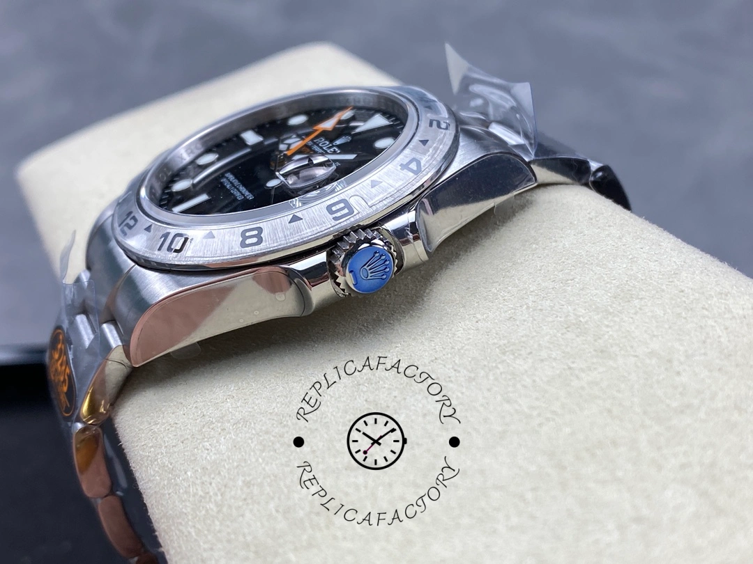 Rolex Explorer II m226570 0002 crown-side close-up, polished case profile and crown, steel bracelet.