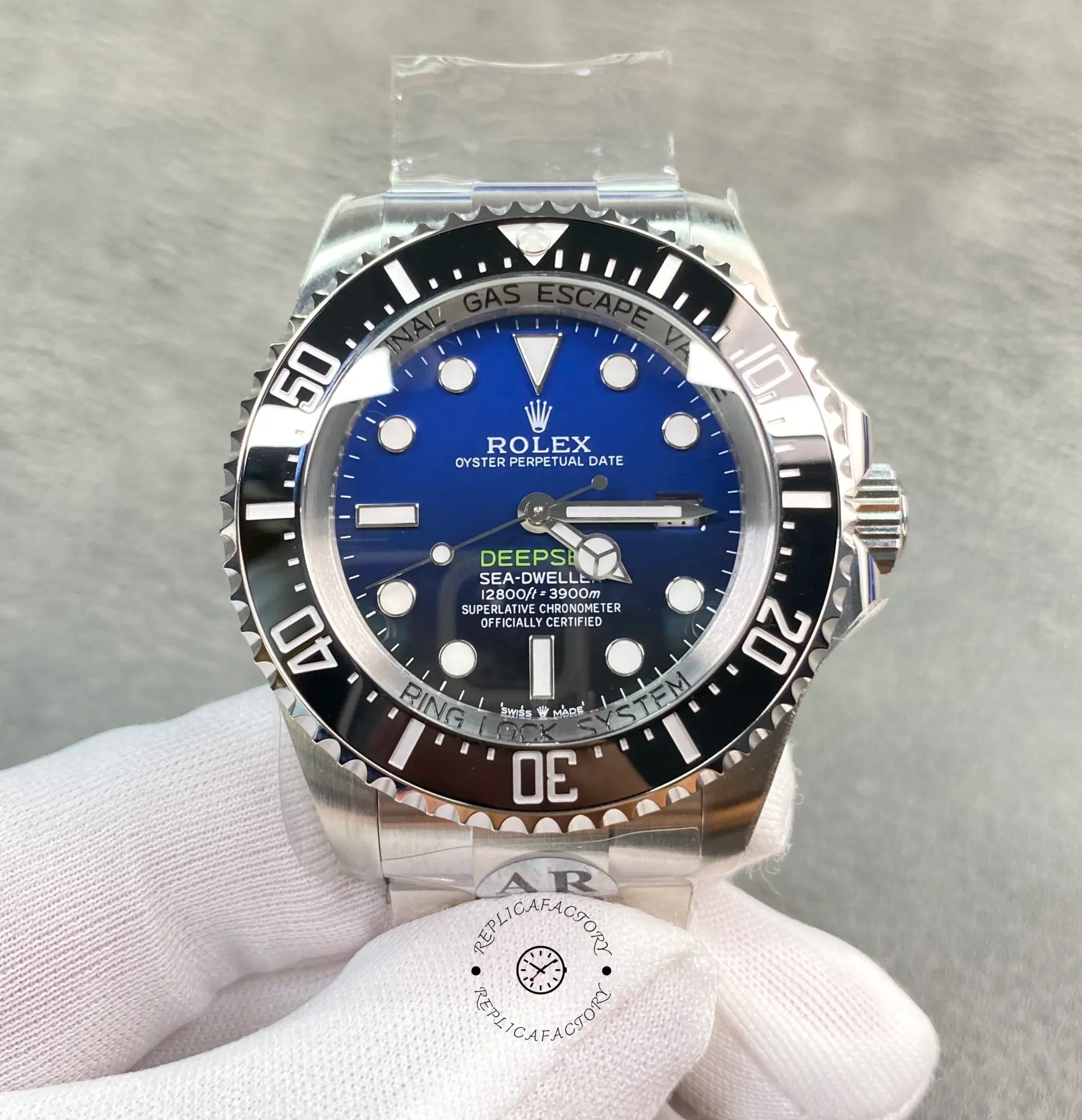 Rolex Sea-Dweller Deepsea 116660, hand-held front view showing D-Blue dial and bezel.