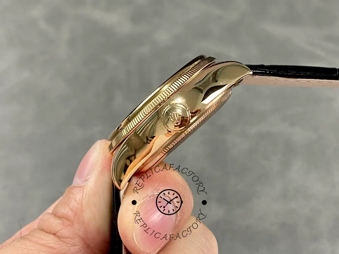 Rolex Cellini Dual Time 50525 crown-side view, rose gold case and fluted bezel edge, black strap.