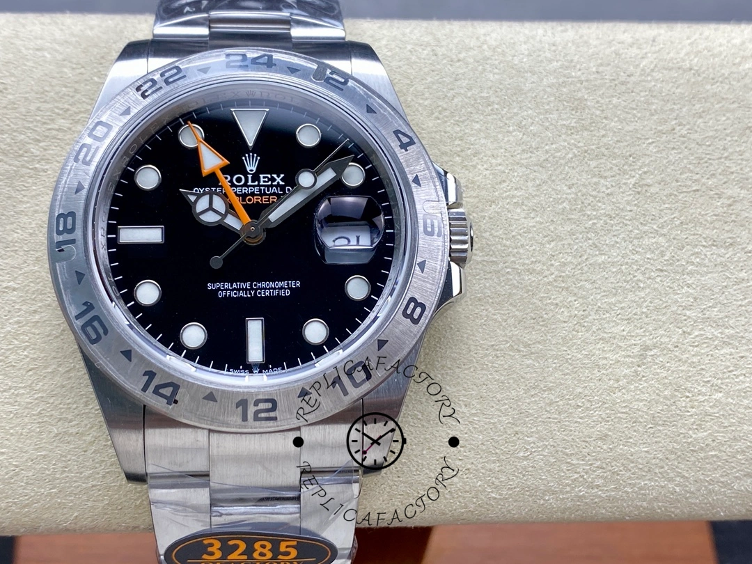 Rolex Explorer II m226570 0002 front view on cushion, black dial with orange GMT hand.