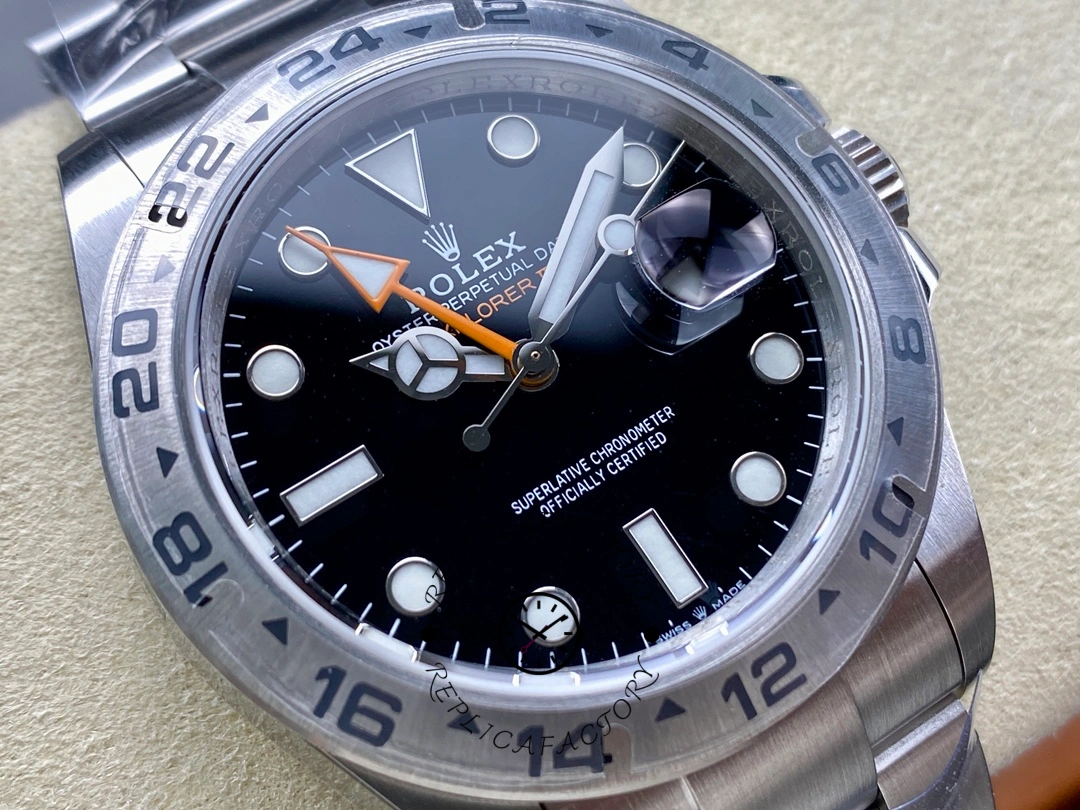 Rolex Explorer II m226570 0002 dial macro, black dial markers and hands, bezel edge.