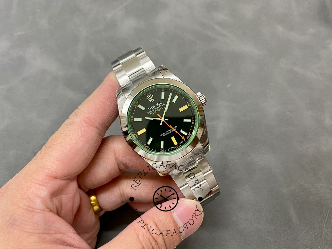 Rolex Milgauss 116400GV, hand holding full watch showing bracelet and dial.