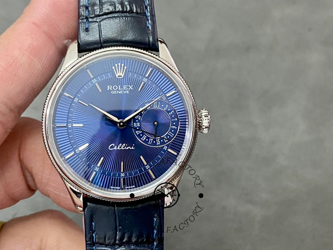 Rolex Cellini Date 50519 held in hand, blue dial and date subdial, front view.