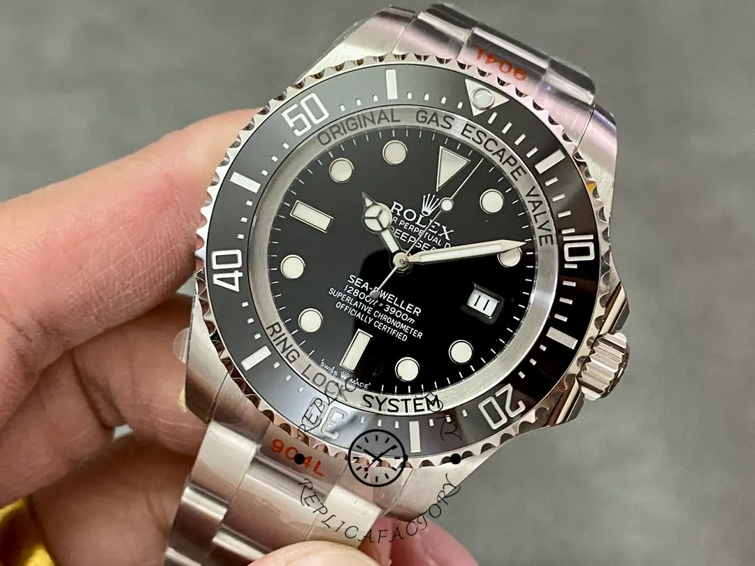 Rolex Deepsea 126660 close front view, black dial details and bezel markers, in hand.