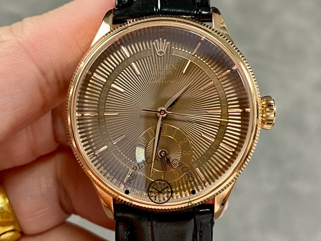 Rolex Cellini Dual Time 50525 held in hand, brown guilloché dial and subdial, front view.