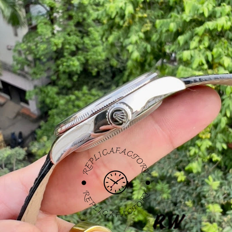 Rolex Cellini Dual Time 50529, side profile on finger showing crown and polished case edge.