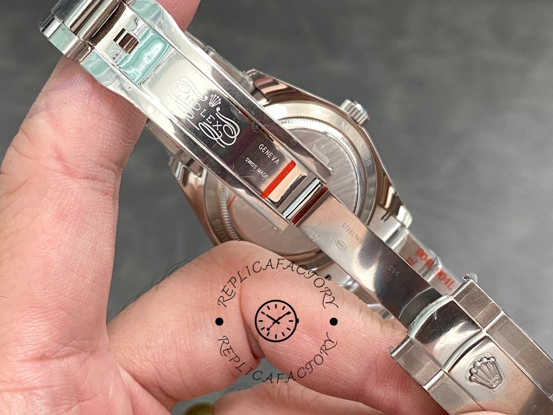 Rolex Milgauss 116400 LNT01HS-001, clasp and bracelet detail shown in hand.