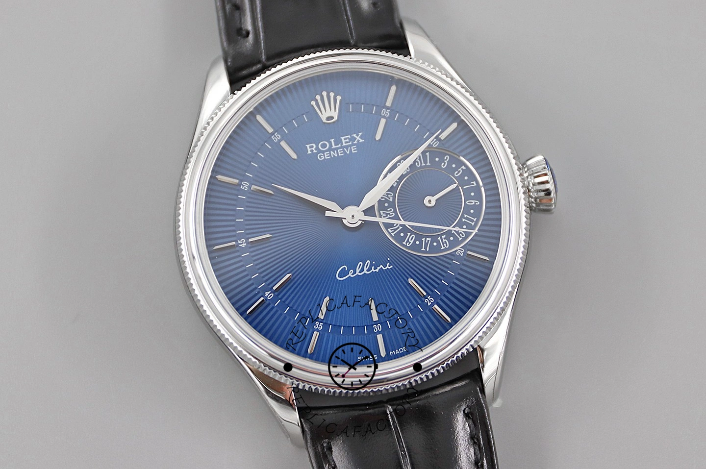 Rolex Cellini Date 50519 front view on gray, blue dial and blue leather strap.
