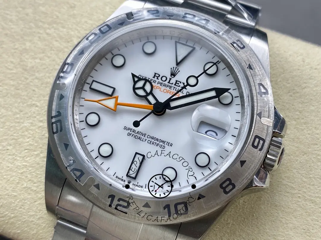 Zoomed dial shot of the Rolex Explorer II m226570 0001, showing hands, lume plots, and minute track.