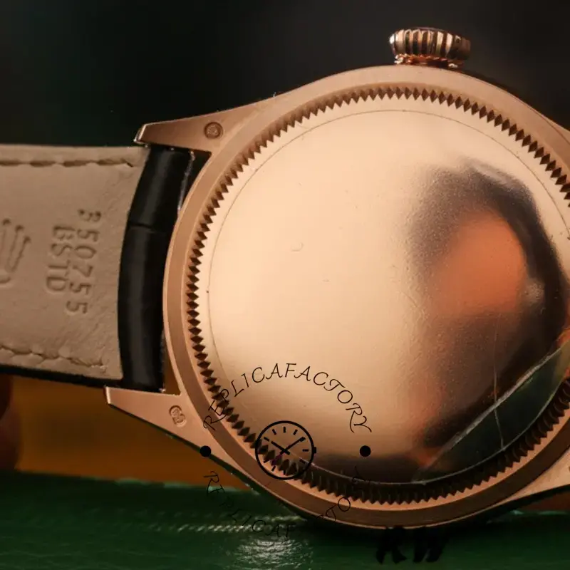 Rolex Cellini Time 50505, rear view of the case, smooth rose gold back, black leather strap.