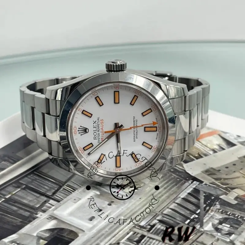 Rolex Milgauss 116400 top view on papers, white dial and orange markers, steel bracelet.