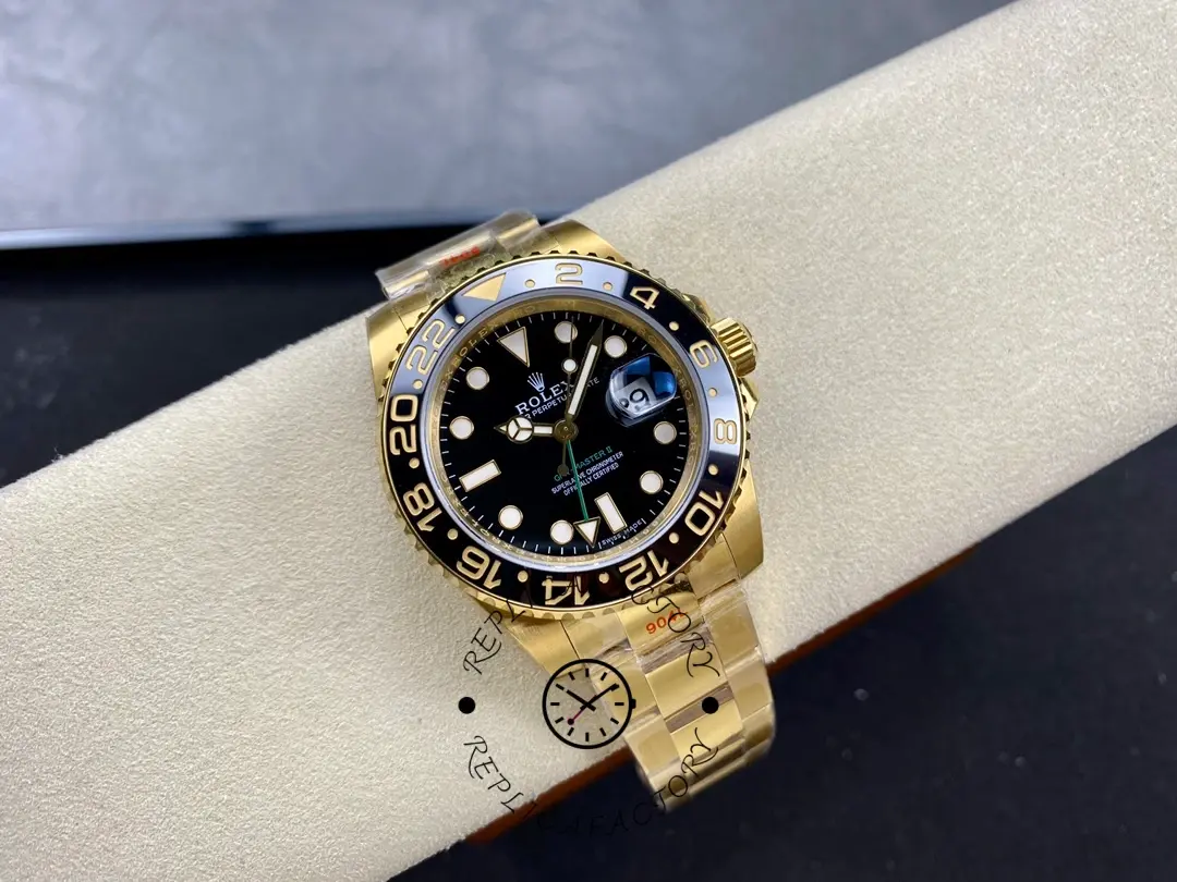Wrist-on-roll shot of Rolex GMT-Master II 116718LN showing gold bracelet fit and black dial.
