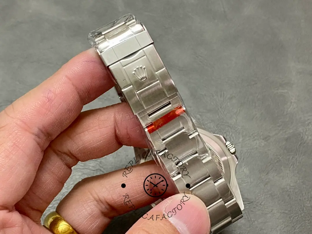 Rolex GMT-Master II 16710, bracelet close-up held in hand showing link finish.