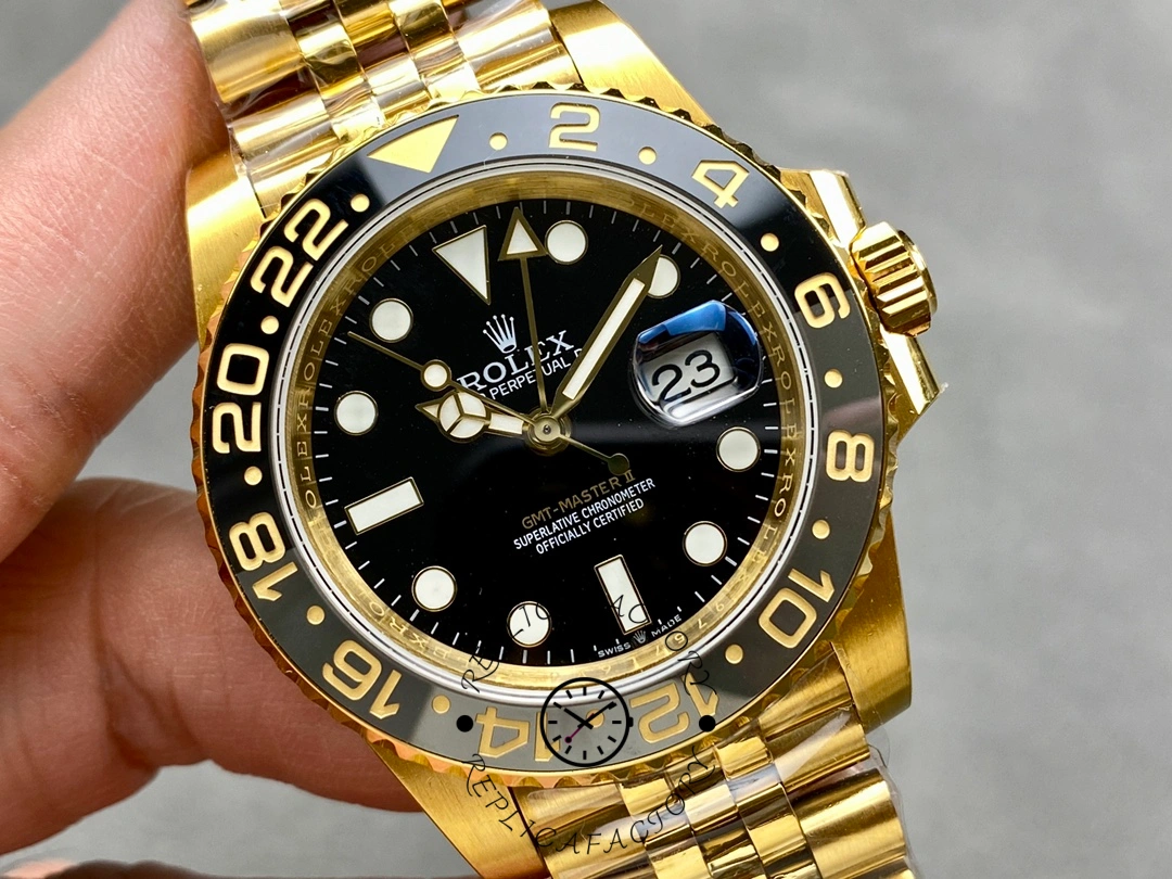 Rolex GMT-Master II m126718grnr 0001, hand-held dial close-up showing GMT hand and markers.