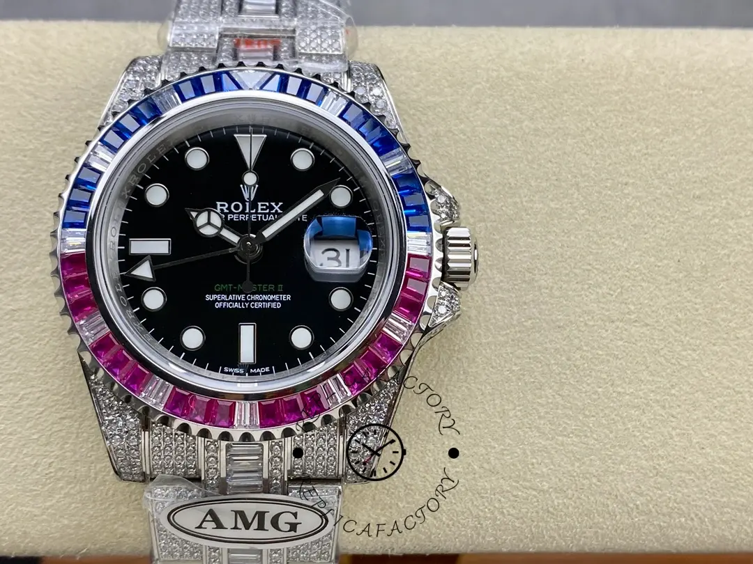 Rolex GMT Master AMG 126710BLRO on cushion, front view with diamond bezel and black dial.