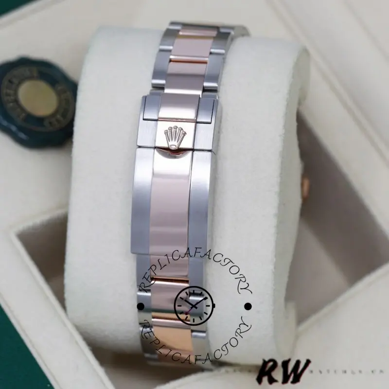 Bracelet on cushion of Rolex GMT-Master II 126711CHNR, showing clasp area and links.