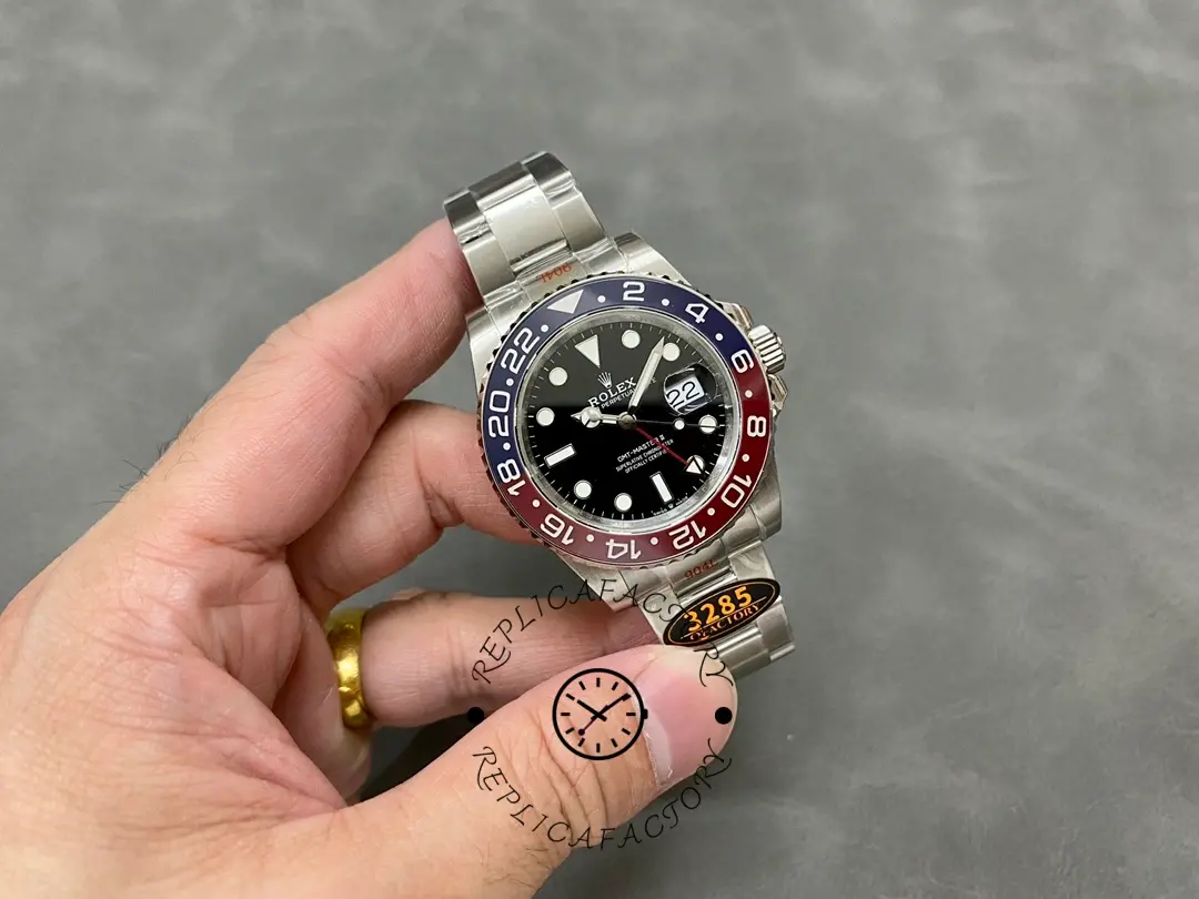 Rolex GMT-Master II 126710BLRO 0002 held in hand, full watch view with bracelet.