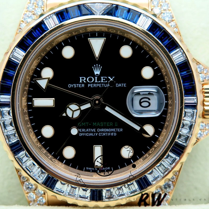 Dial close-up of the Rolex GMT-Master II 116758 showing date window and diamond bezel.