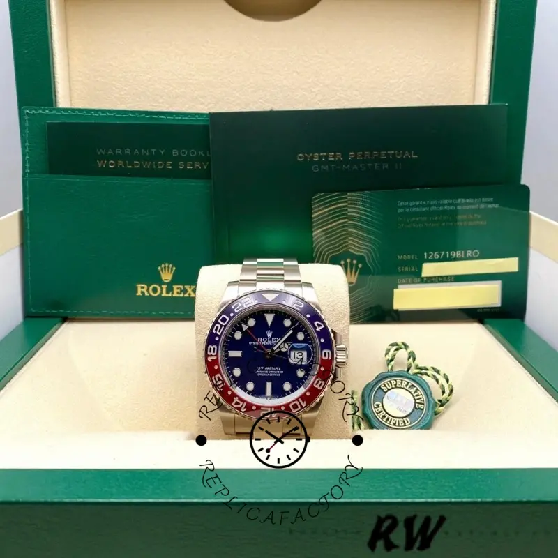 Box set photo of Rolex GMT-Master II 126719BLRO with papers and green presentation box.