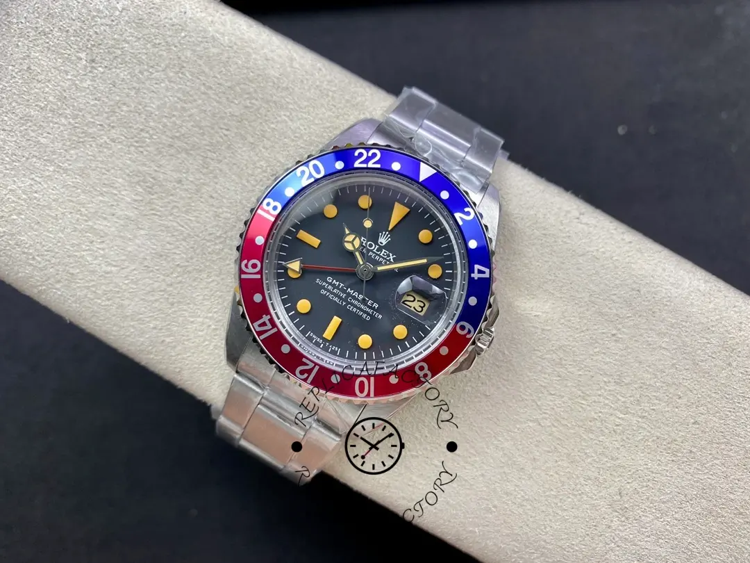 Rolex GMT-Master II 16710, top view on cushion showing dial and bezel colors clearly.