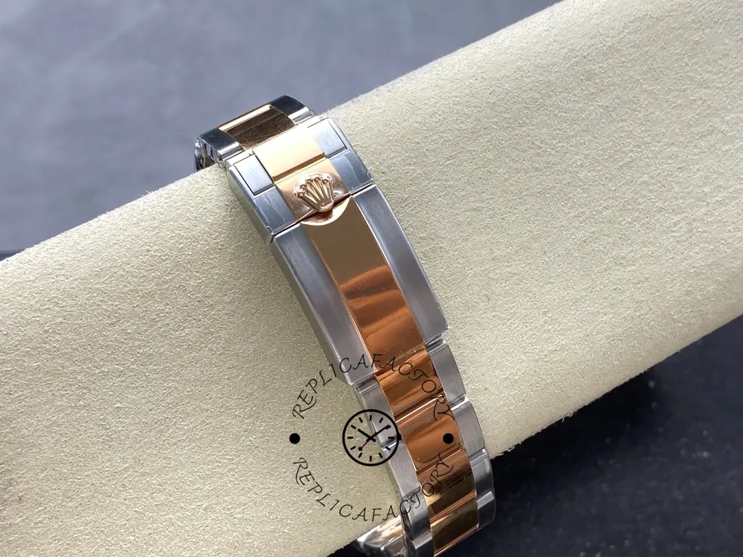 Bracelet on cushion of Rolex GMT-Master II 126711CHNR, showing clasp area and links.