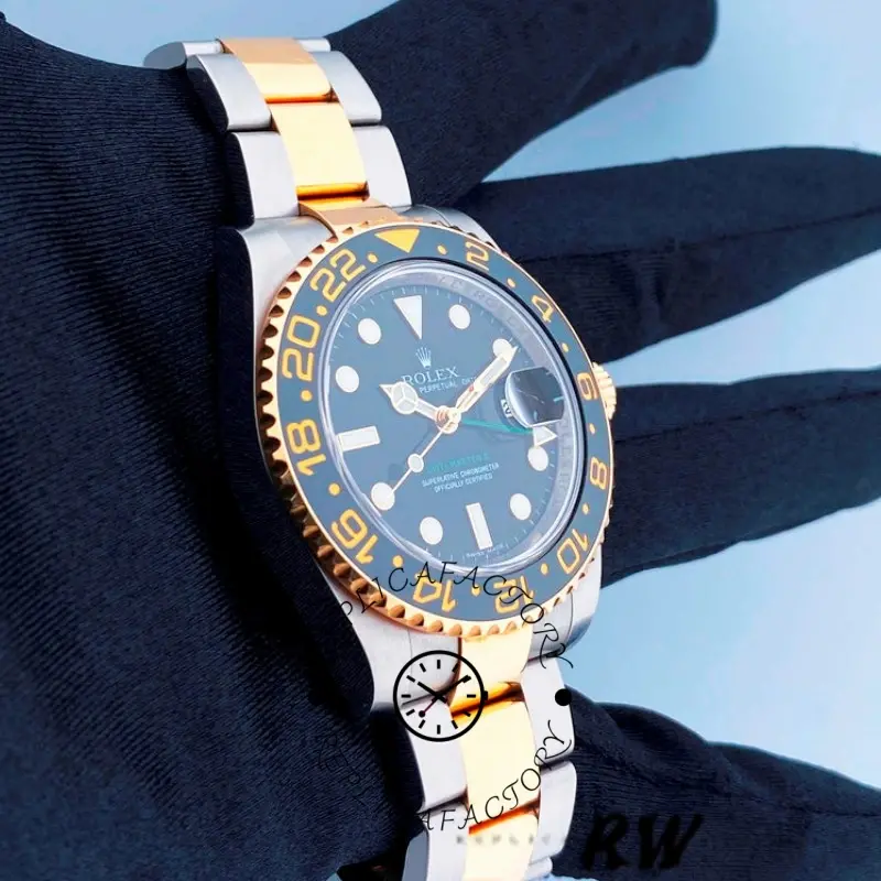 Wrist shot of the Rolex GMT-Master II 116713LN showing black dial and two-tone bracelet.