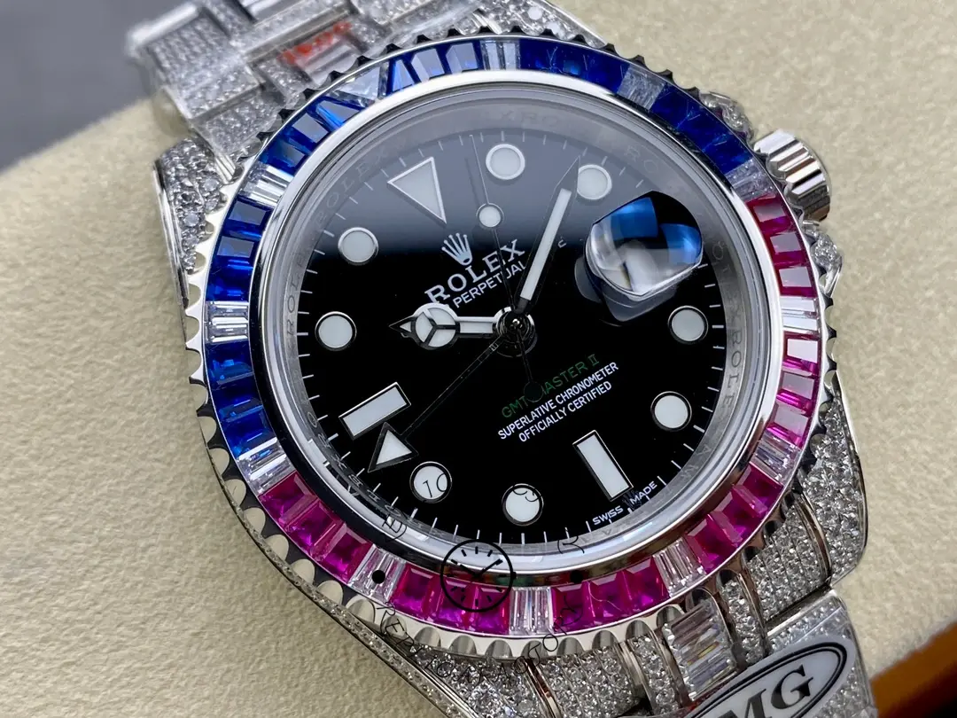 Close-up of the Rolex GMT Master AMG 126710BLRO showing black dial, date, and diamond bezel.