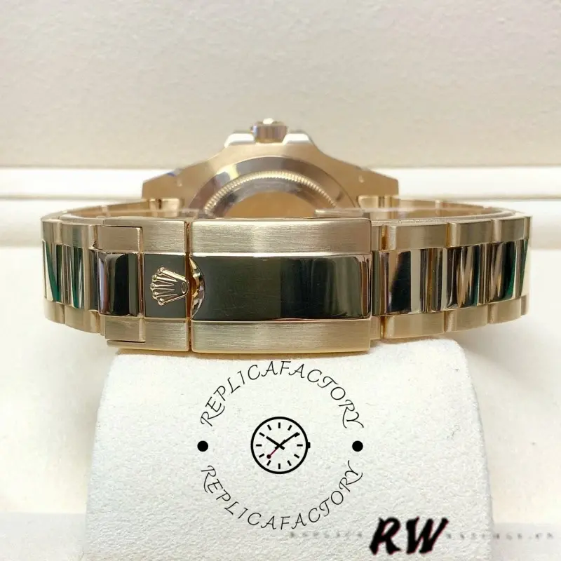 Rolex GMT-Master II 116718LN, full bracelet view showing gold links and clasp from side.