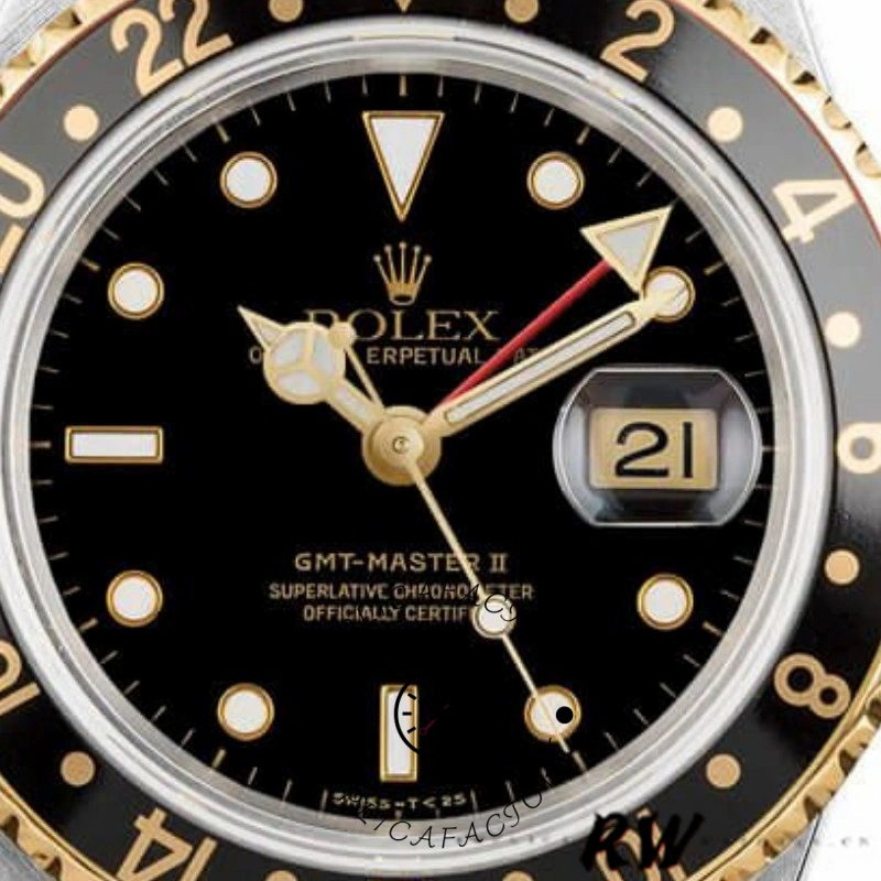 Dial close-up of the Rolex GMT-Master II 16713LN showing date window and gold hour markers.