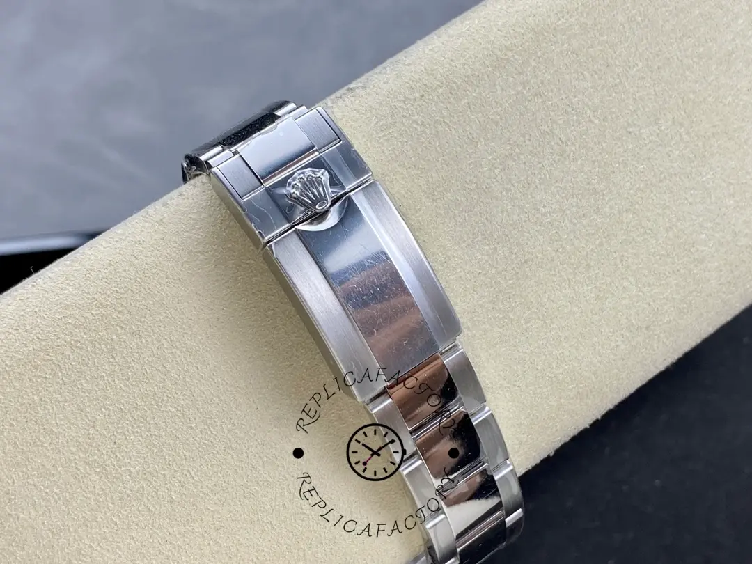 Rolex GMT-Master II 116710LN, bracelet clasp view on cushion showing clasp closed.