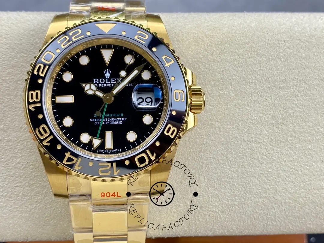 Rolex GMT-Master II 116718LN on cushion, full front view with black dial and gold bracelet.