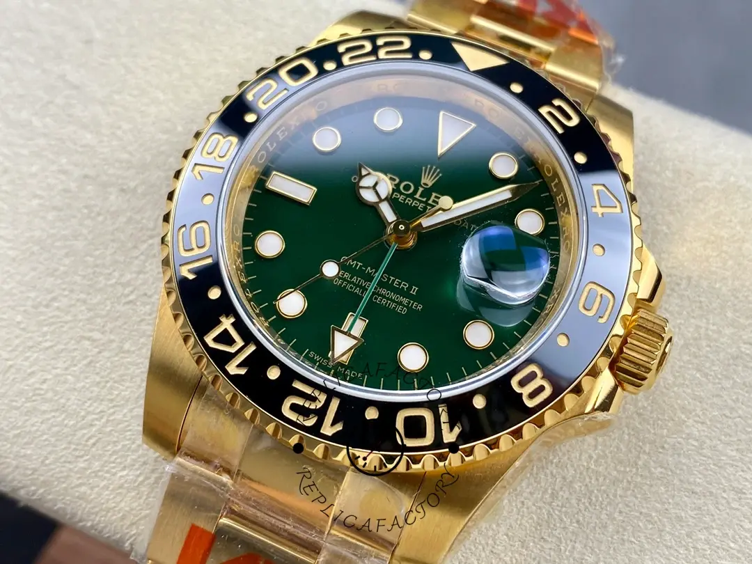 Rolex GMT-Master II 116718LN, hand-held front view showing green dial and black bezel.
