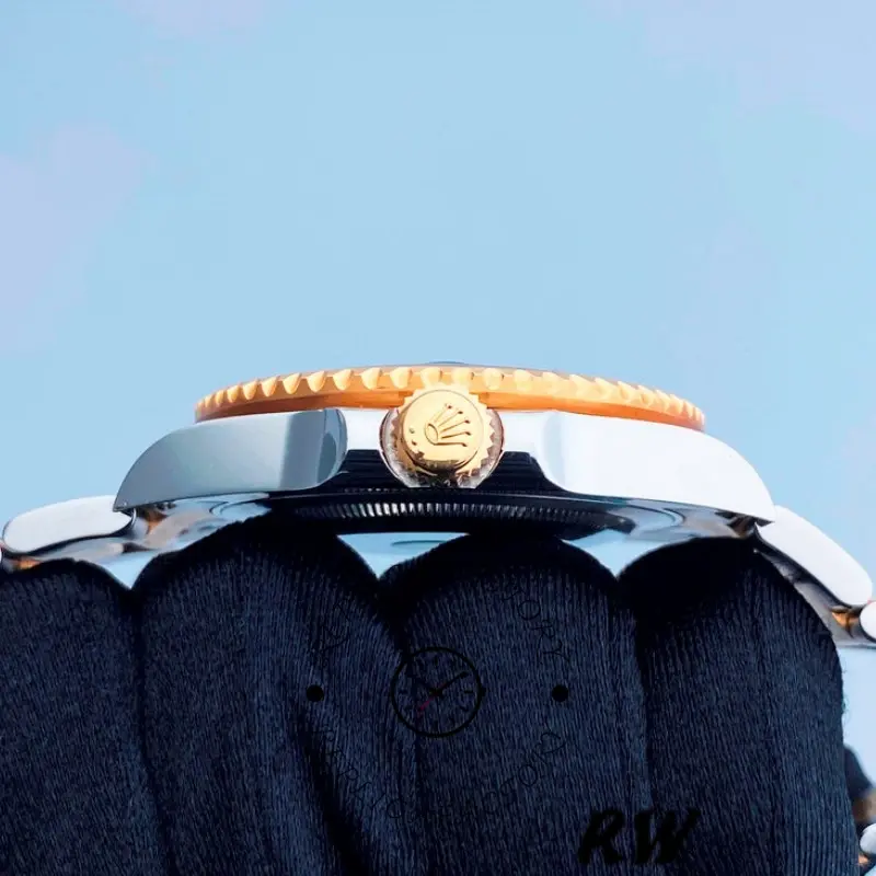 Side profile on wrist of the Rolex GMT-Master II 116713LN showing crown and bezel.