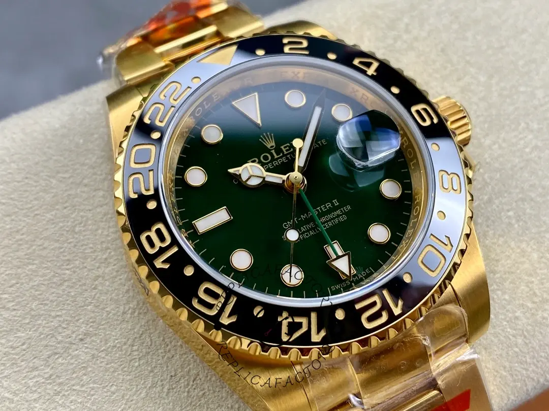 Rolex GMT-Master II 116718LN, close-up wrist view showing bezel and green dial.